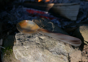 Horn spoon by campfire